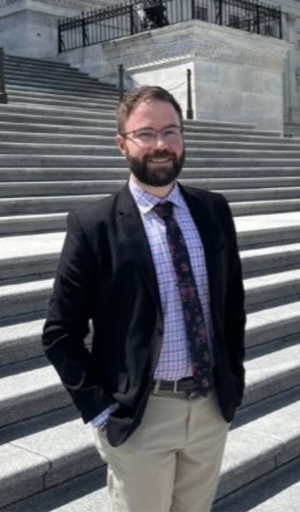 nathaniel-carrington standing on the steps in front of a government building