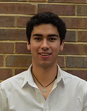 Oscar Alvarez poses for a headshot outside of the Edward Jones Data Analytics Lab at Saint Louis University's Chaifetz School of Business