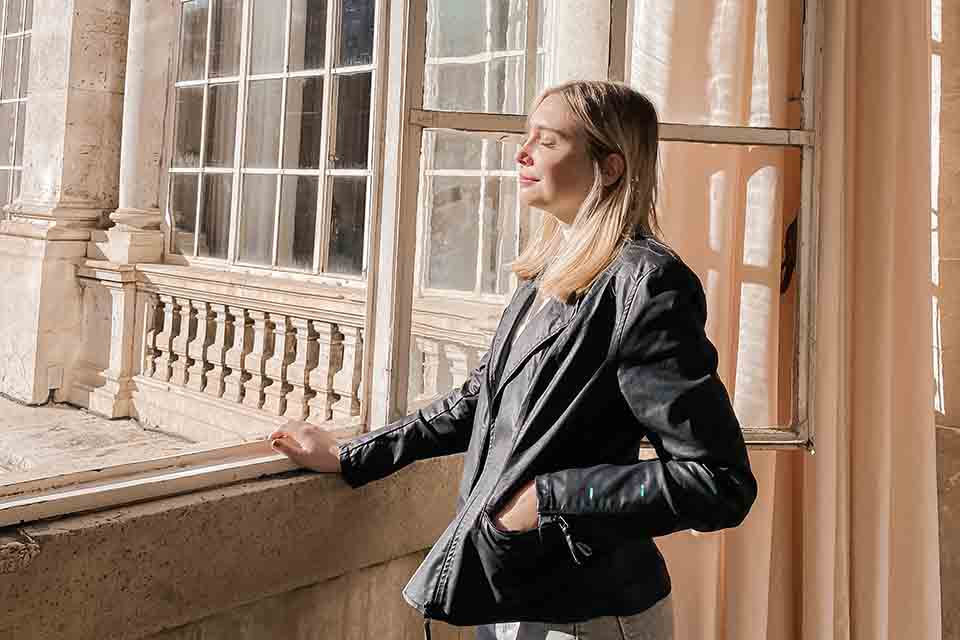 Woman standing at window