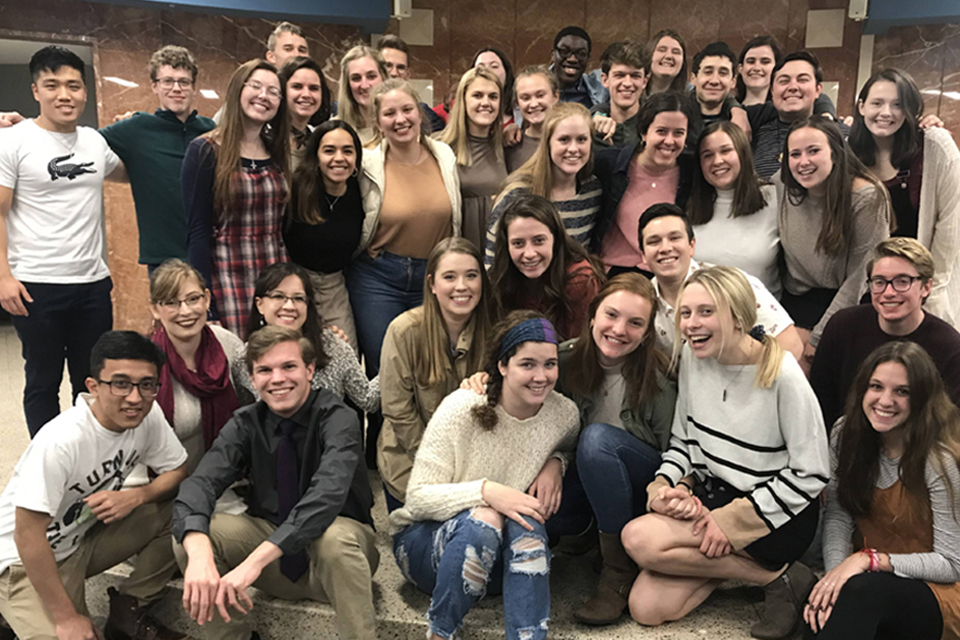 A group of Micah students pose for a photo together.