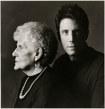 A black-and-white photograph by Carolyn Jones. Don Adler is at the right of the image, looking at the viewer, while his mother sits to his left facing away from him toward the left edge of the picture frame.