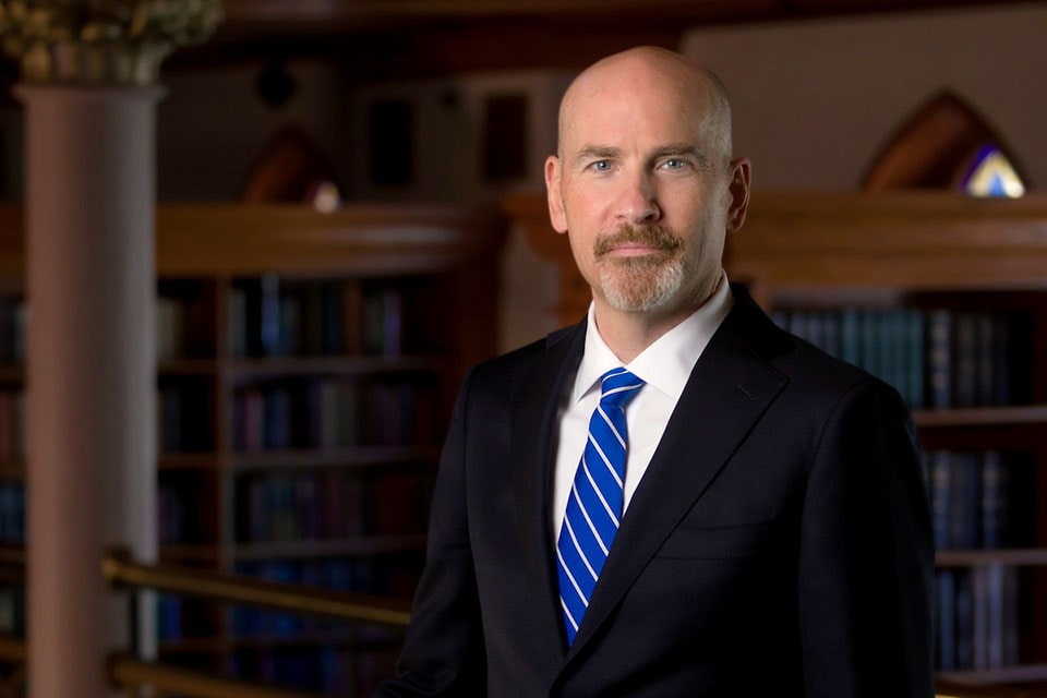 Edward J. Feser, Ph.D., poses for a headshot in Pere Marquette Gallery